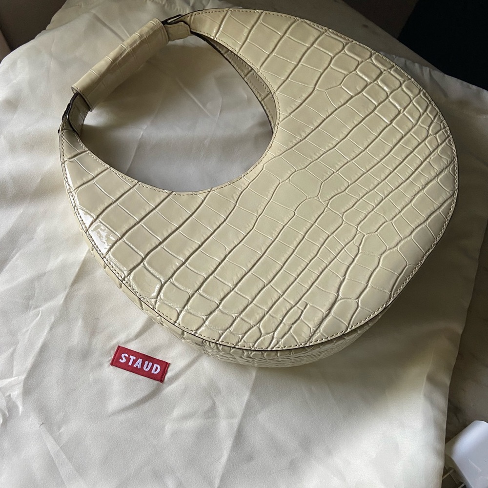 Staud moon bag in lovely cream colour . Ideal for all seasons .